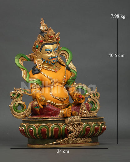 Side view of Dzambhala statue, a Himalayan wealth deity sculpture with detailed metal craftsmanship and traditional sacred Nepalese artistry