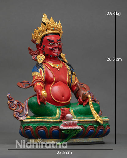 Side view of Dzambhala statue holding citron fruit and mongoose symbolizing prosperity and removal of obstacles copper lost wax casting sacred art Nepal