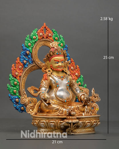 Side view of Dzambhala statue seated on lotus pedestal with decorated halo holding mongoose and citron symbol wealth deity sculpture