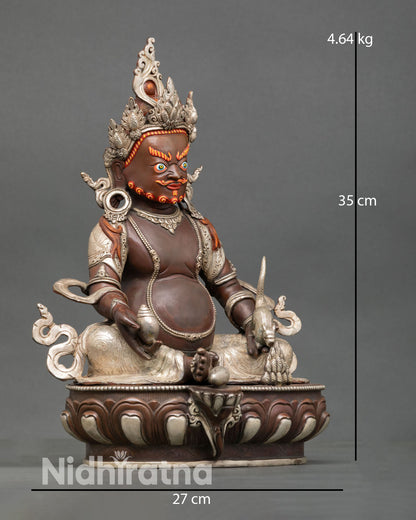 Side view of Dzambhala statue, silver plated finish Nepalese craftsmanship prosperity deity spiritual decor