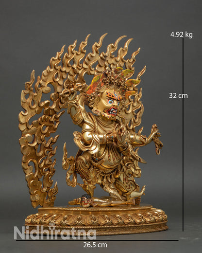 Side view of Four-Armed Vajrapani holding vajra standing on lotus over subdued figure copper gold Buddhist statue Nepal