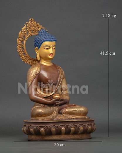 Side view gold gilded robes repoussé copper Buddha sculpture showing intricate Himalayan craftsmanship
