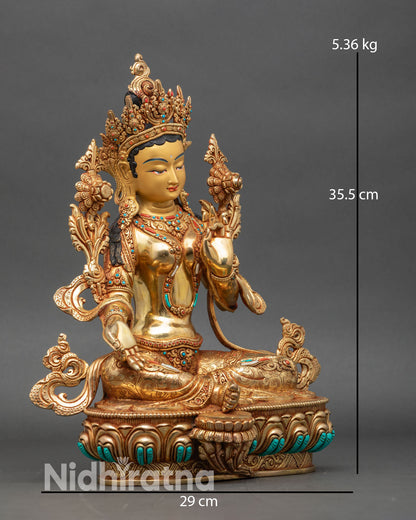 Side view Green Tara statue lotus pedestal varada abhaya mudras sacred art