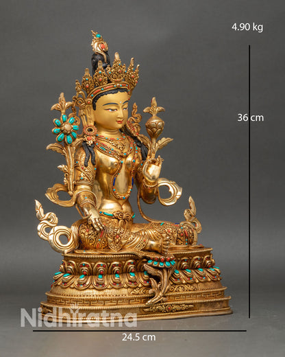 Side view Green Tara statue seated on double lotus pedestal with varada and abhaya mudras