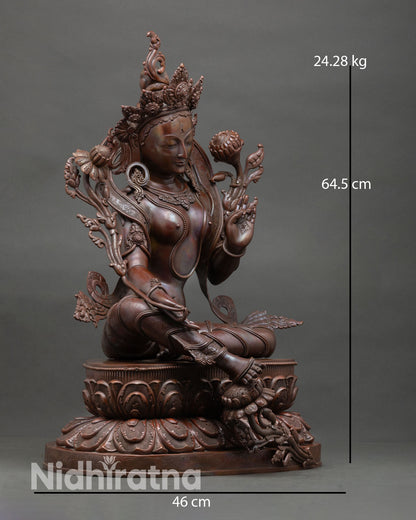 Side view of Green Tara statue seated royal ease posture double lotus pedestal, Varada mudra, Buddhist spiritual sculpture Nepal art