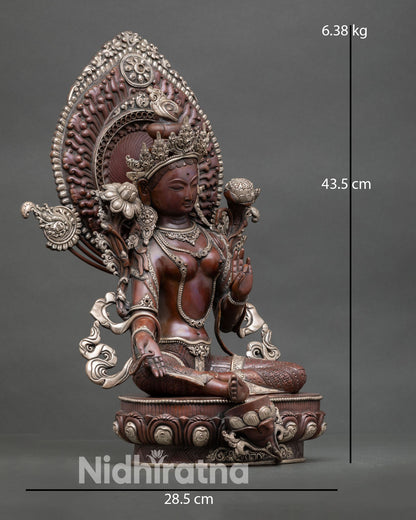 Side view of Green Tara statue showing Varada Mudra and Vitarka Mudra seated on lotus base handcrafted copper meditation altar decor