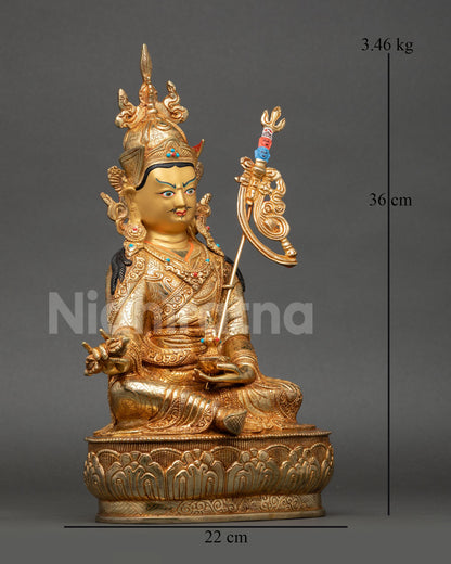 Side view of Guru Rinpoche meditation statue copper 24K gold gilded Nepalese Newari artisan sculpture with sacred symbols