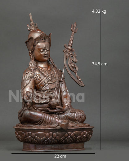 Side view of Guru Rinpoche statue crafted by Newari artisan in Patan, Nepal, using traditional lost wax casting method
