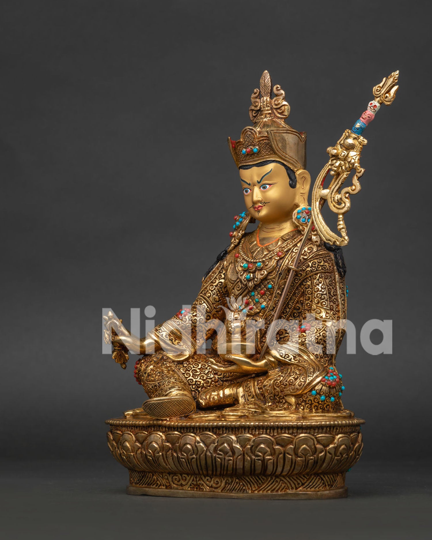 Side View Guru Rinpoche Statue Holding Vajra Skull Cup and Khatvanga.
