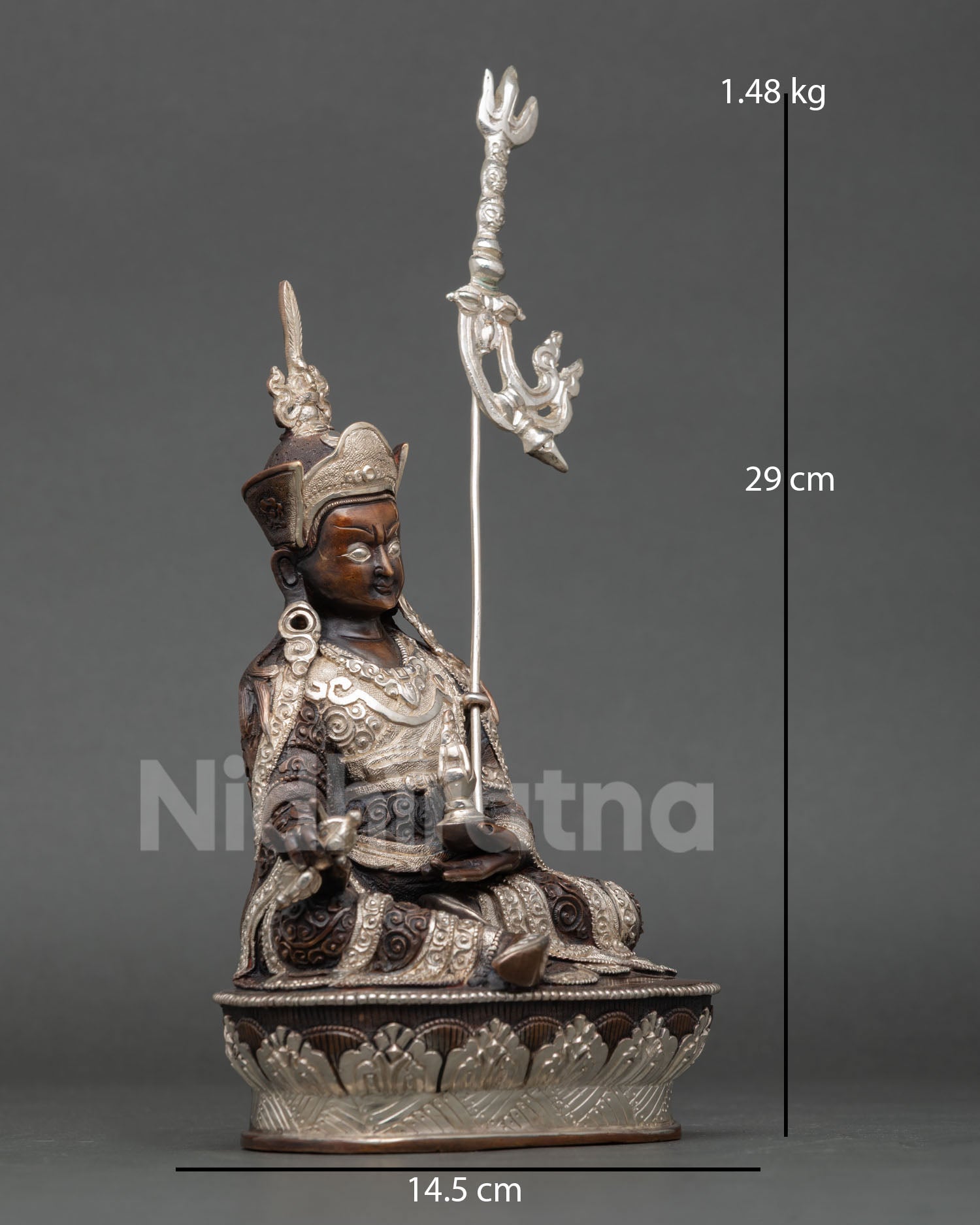 Side view Guru Rinpoche statue, trident staff, flowing robes, intricate Himalayan metal art copper sculpture meditation spiritual decor