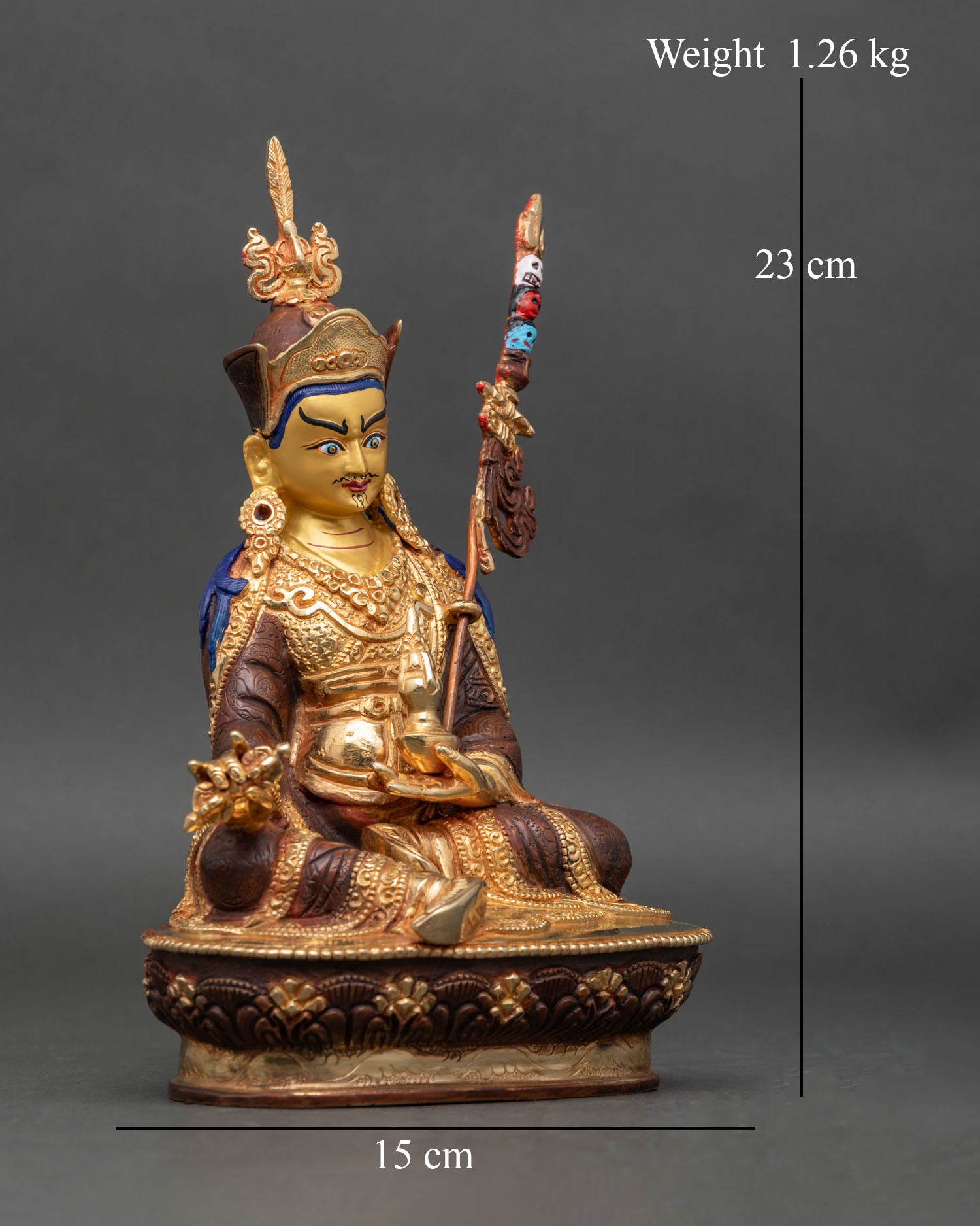 Side view Guru Rinpoche statue vajra kalash khatvanga Tibetan Buddhist sculpture Nepal