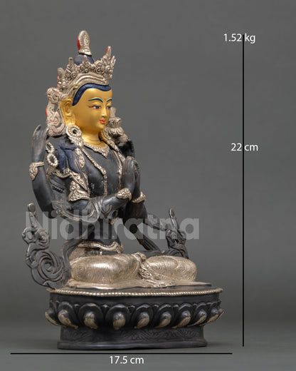 Side view of handcrafted Chenrezig statue in oxidized copper finish, traditional Himalayan metal artistry and refined sculptural detailing 
