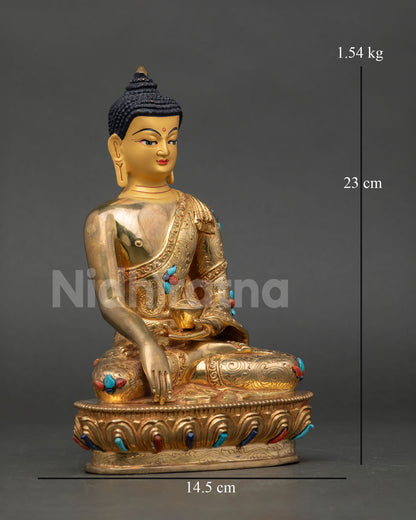Side view of handcrafted Shakyamuni Buddha on lotus pedestal with monastic robe details Nepal Newari artisan Buddhist sculpture for altar