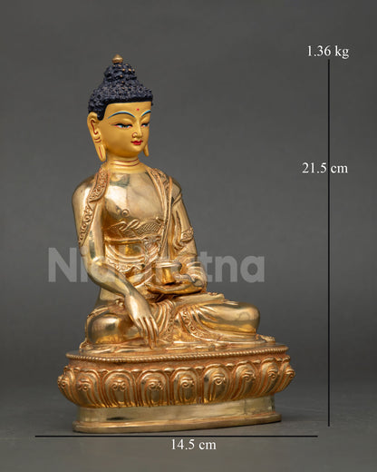 Side view of handmade Buddha Shakyamuni copper statue holding begging bowl symbolizing compassion and renunciation Himalayan art