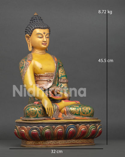 Side view of handmade Buddha Shakyamuni statue seated on lotus pedestal from Nepal