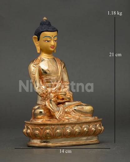 Side view of handmade Medicine Buddha copper statue gold gilded finishing Newari artisan Himalayan Buddhist shrine decor