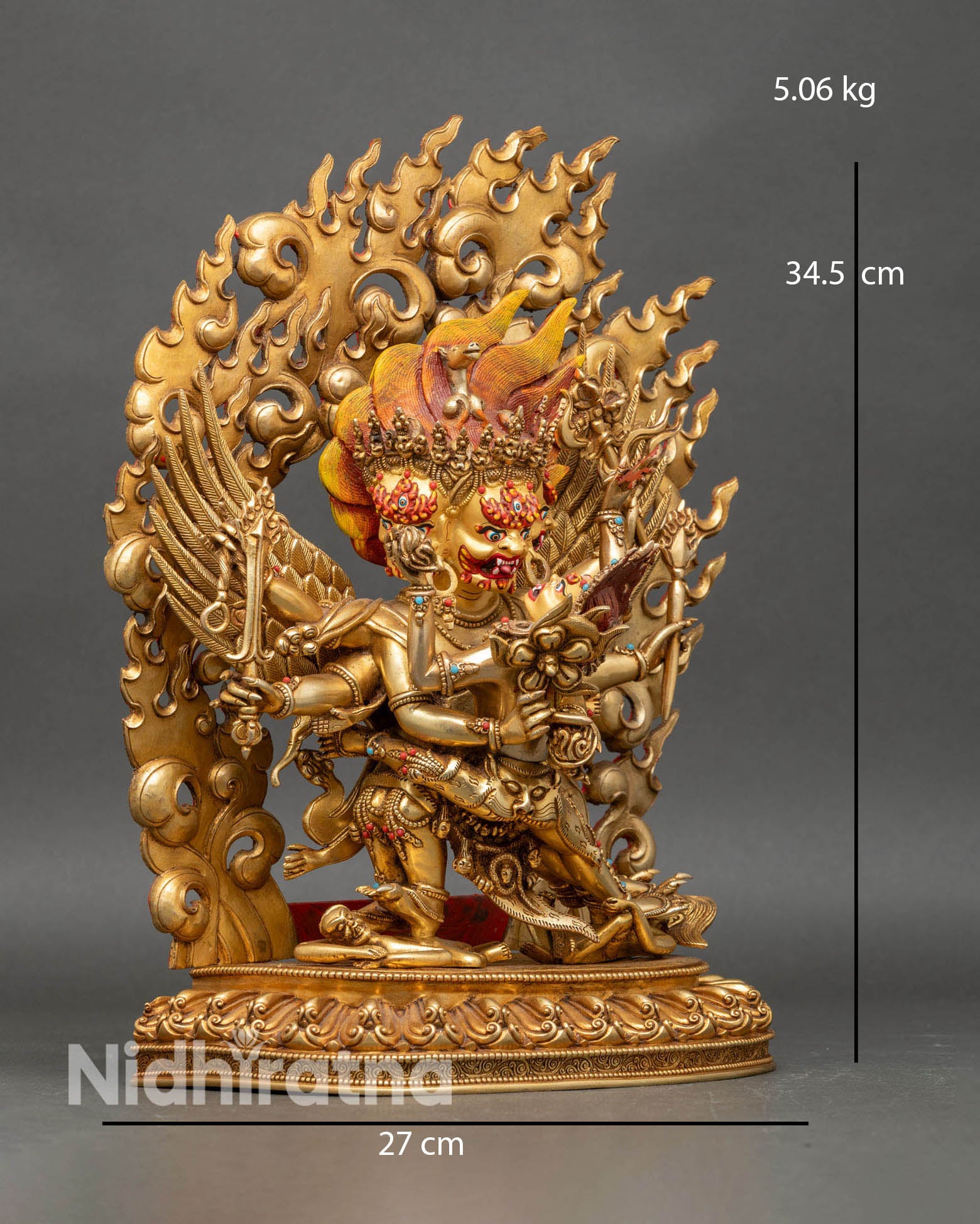 Side view of hayagriva statue with consort on lotus seat and ornate robe