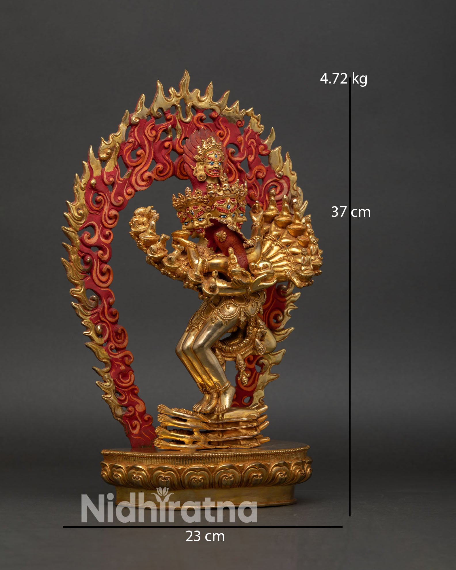 Side view Hevajra statue with consort wrathful tantric form sixteen arms dynamic posture lotus base Himalayan Buddhist sculpture Nepal
