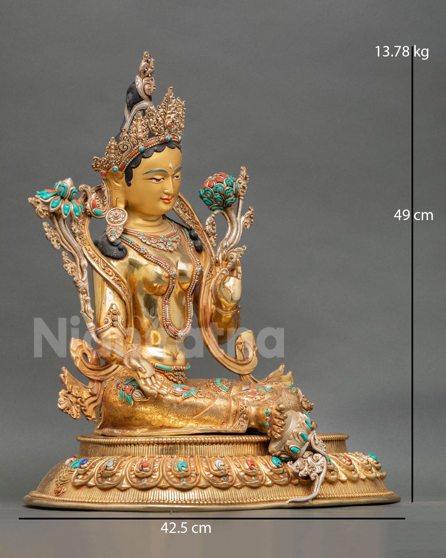 Side view of Himalayan Green Tara copper statue with extended right foot lotus base and intricate ornament details
