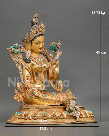 Side view of Himalayan Green Tara copper statue with extended right foot lotus base and intricate ornament details