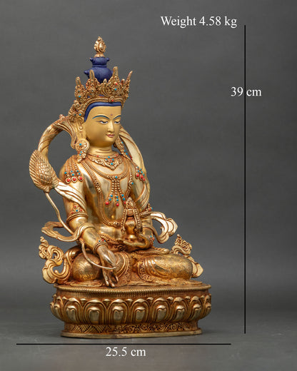 Side view of Himalayan Kshitigarbha Buddha statue with hand-painted gold face and copper body