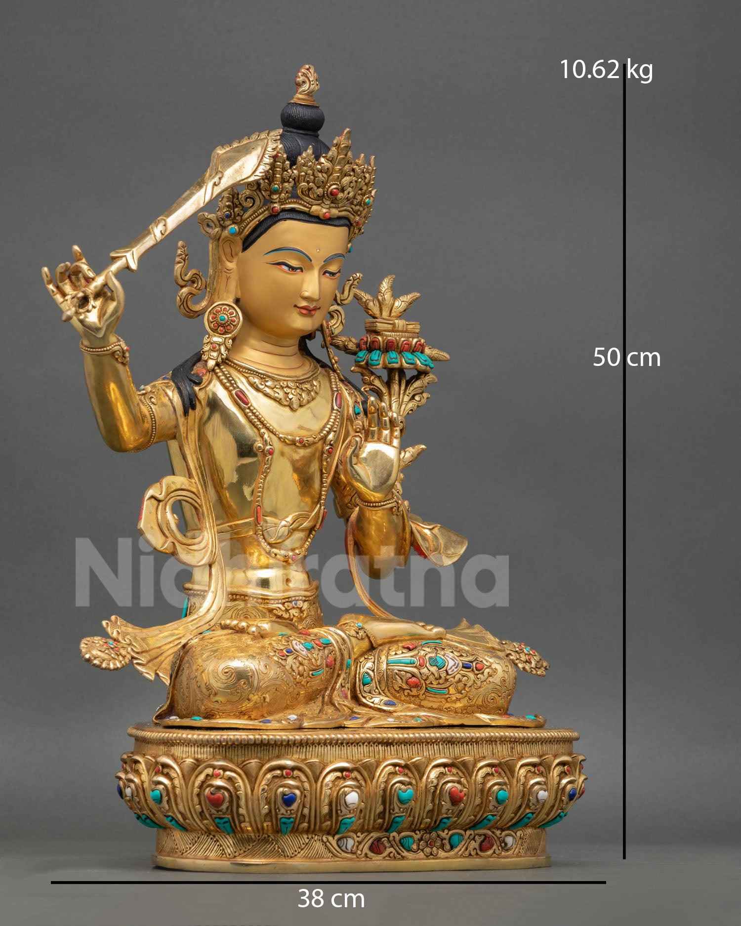 Side view of Himalayan Manjushree copper statue holding flaming wisdom sword and lotus