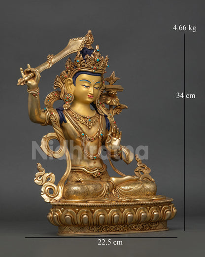Side-view of Himalayan Manjushri sculpture, handcrafted Nepalese copper wisdom deity with utpala flower