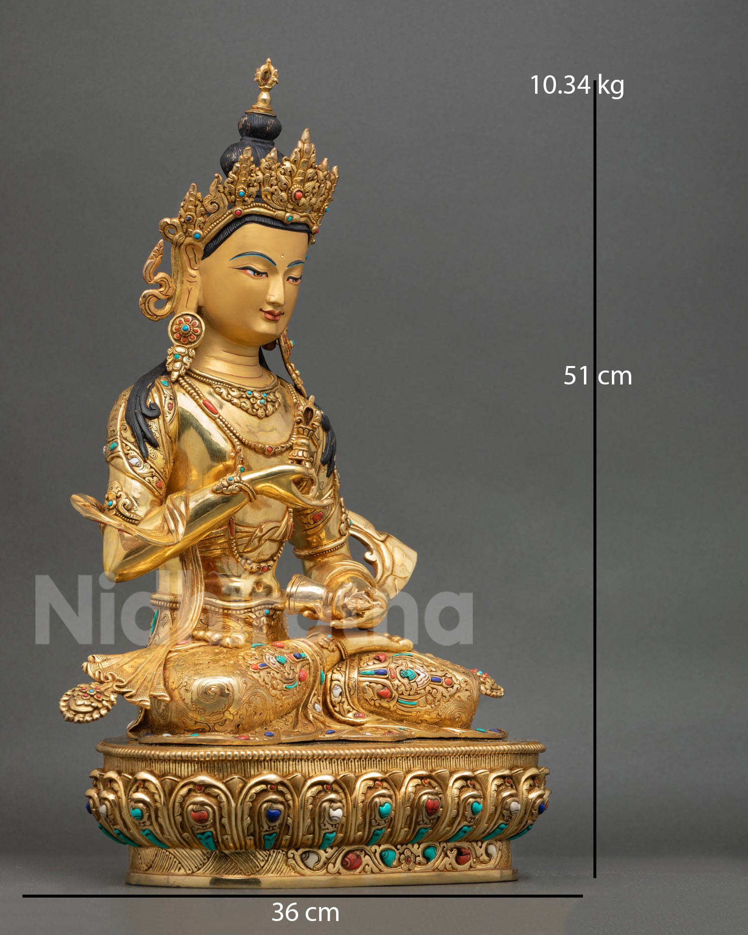 Side view of Himalayan Vajrasattva copper statue holding vajra and ritual bell
