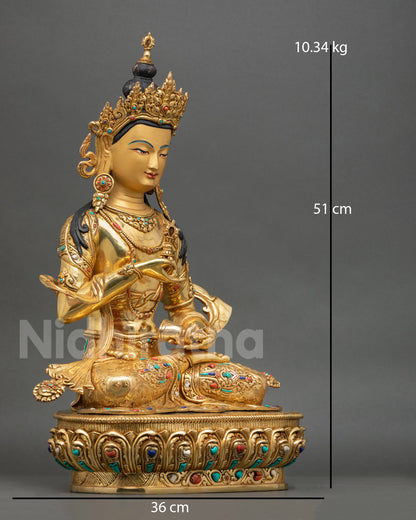 Side view of Himalayan Vajrasattva copper statue holding vajra and ritual bell