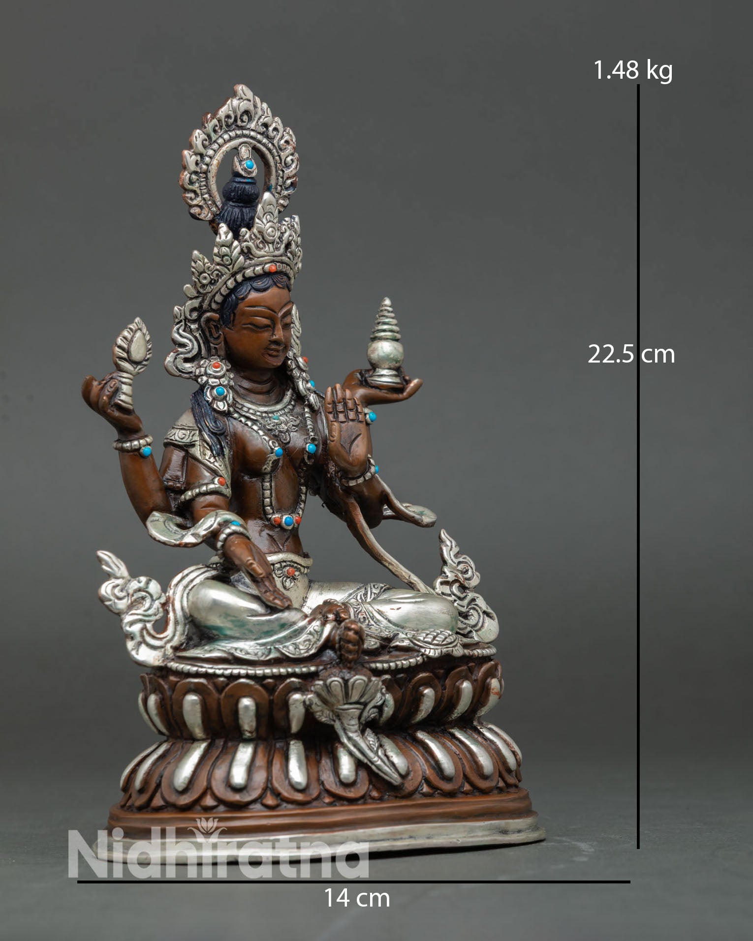 Side view of Laxmi goddess statue handcrafted Patan Nepal silver finish copper spiritual home altar prosperity decor