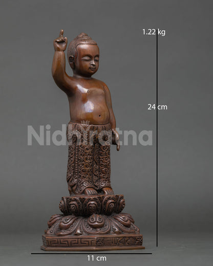 Side view of Little Buddha statue oxidized copper finish, details lotus pedestal traditional Nepal metal art spiritual awakening decor