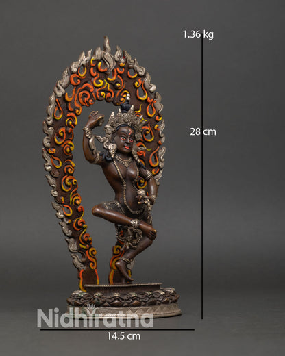 Side view of Machig Labdron statue dancing pose moon disc lotus seat flowing robes halo