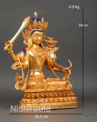 Side view Maha Manjushri statue intricate robes lotus throne gold stone inlays
