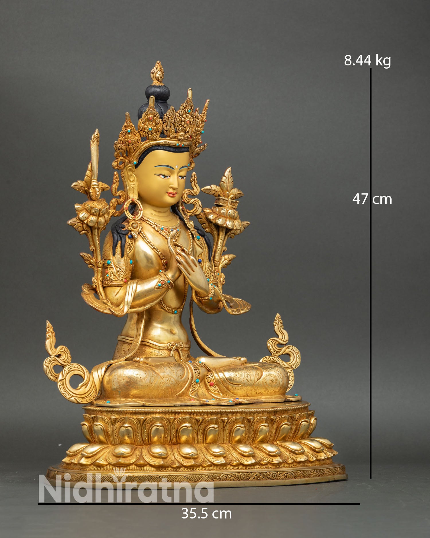 Side view Manjushree statue double lotus throne right leg extended lotus flower Dharmachakra mudra copper gold detailing Nepal