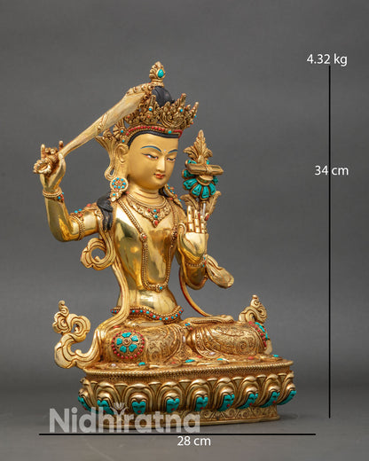 Side view Manjushree statue engraved robes semi-precious stones sacred art
