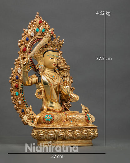 Side view of Manjushri statue, flaming sword of wisdom, Prajnaparamita scripture, lotus seat 