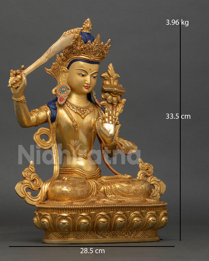 Side view of Manjushri Statue, lost wax casting, copper sculpture, gold detailing, semi-precious stones, Nepal art
