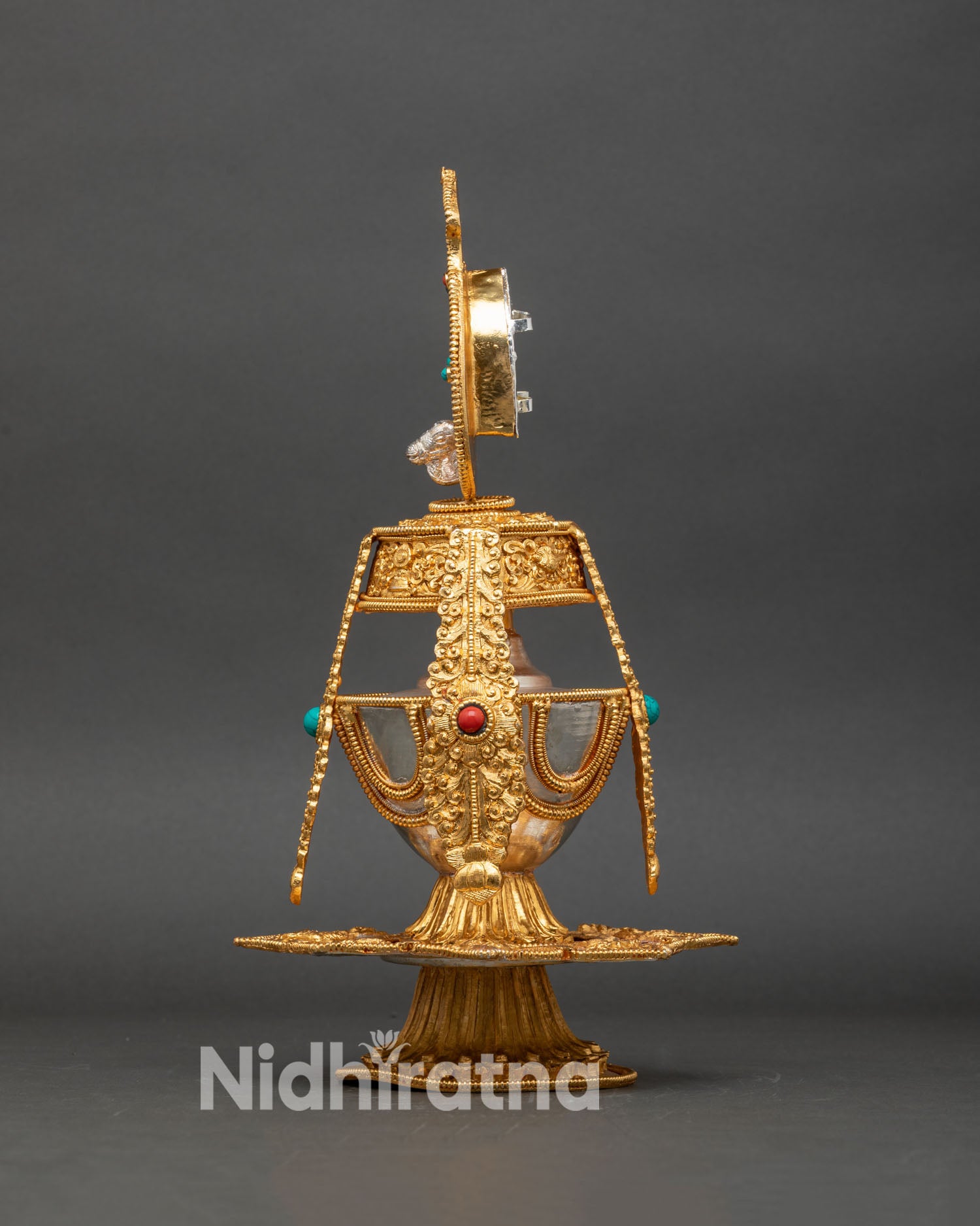 Side view Nepalese Che Bumba water offering vessel with intricate design