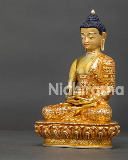 Side view of Amitabha Buddha statue in Dhyanamudra holding an alms bowl 24K gold fire gilded copper.