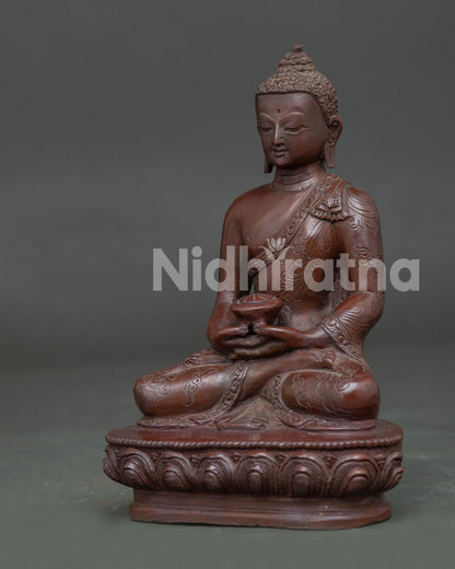 Side view of Amitabha Buddha Statue seated on lotus pedestal with oxidized copper finish details.