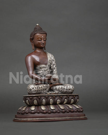 Side view of Amitabha Buddha statue with intricate silver plated robe details.