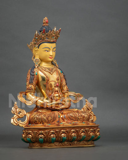 Side view of Amitayus Buddha statue showing intricate silk garment carvings, ornate golden jewelry, full lotus posture, and traditional Newari craftsmanship.