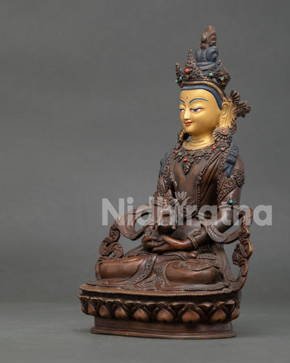 Side view of Amitayus statue seated on lotus throne holding the sacred ambrosia vase.