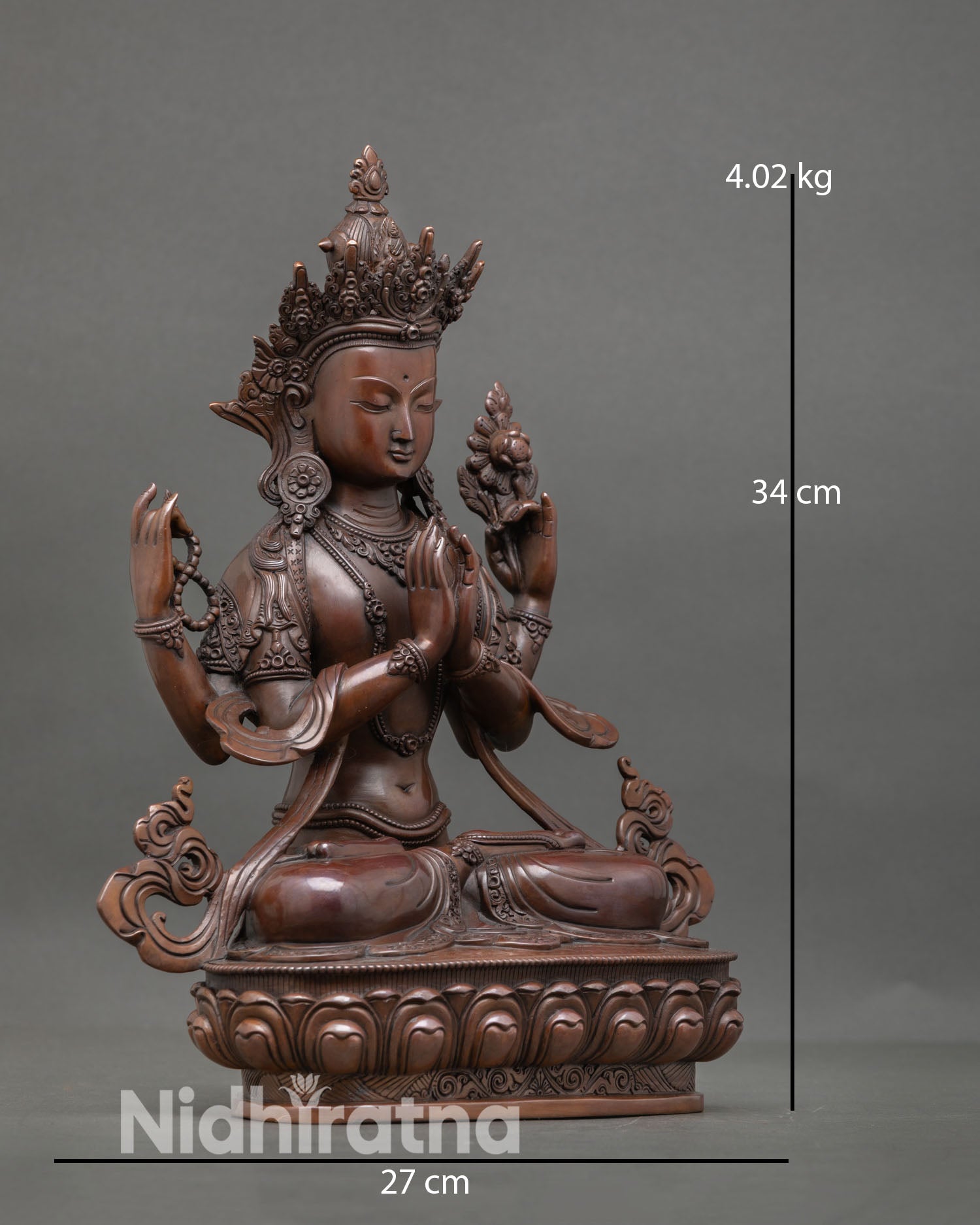 Side view of Avalokiteshvara Chenrezig statue in meditative posture with refined oxidized texture