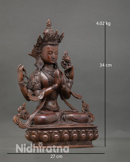 Side view of Avalokiteshvara Chenrezig statue in meditative posture with refined oxidized texture