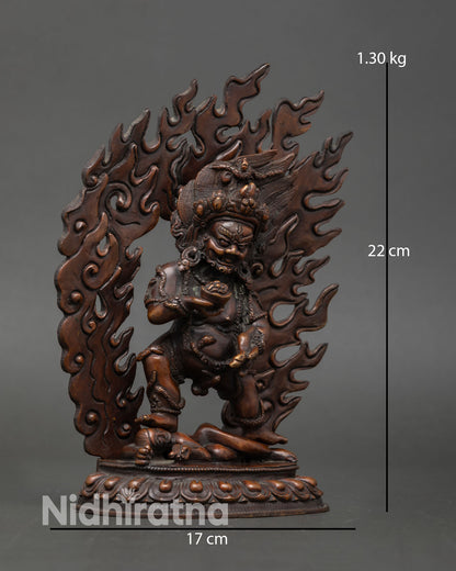 Side view of Black Dzambhala wealth deity statue, crafted in copper with oxidized finish, Buddhist art style.