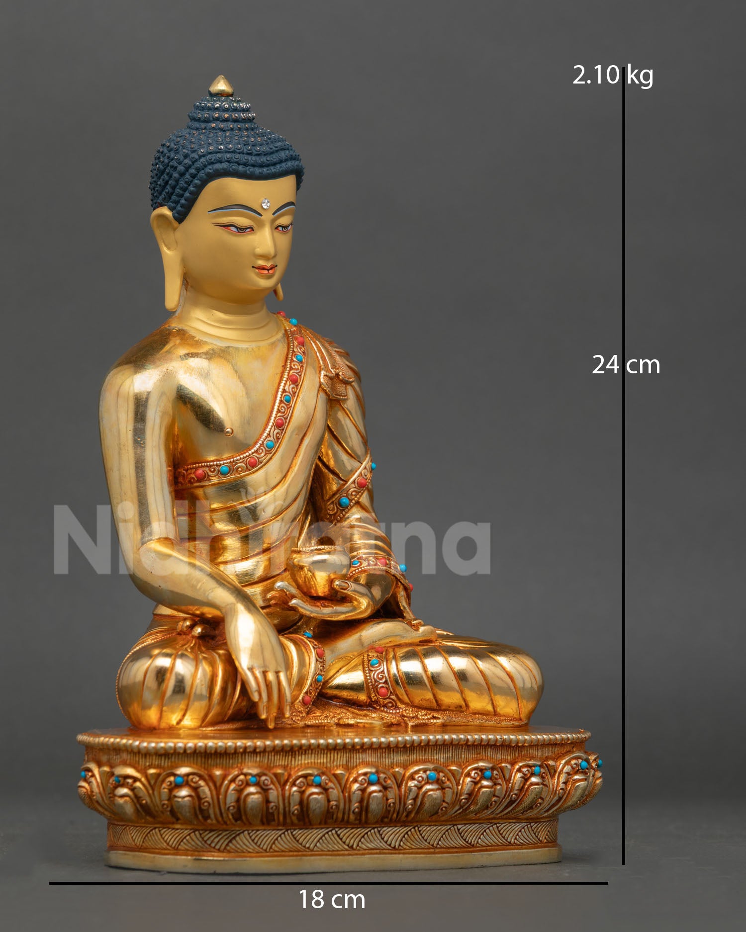 Side view of Buddha Shakyamuni statue seated on a lotus pedestal with earth-touching mudra and a patra bowl