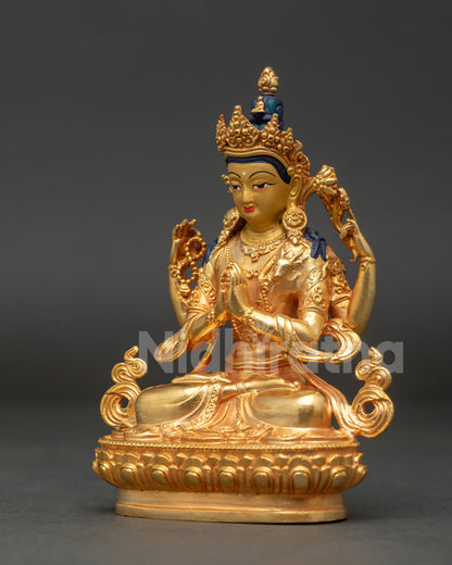 Side view of Chenrezig statue with sacred mala lotus flower and detailed gold gilded ornaments.