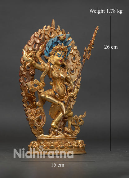 side view of Dorje Phagmo statue standing posture adorned with semi-precious stones hand-painted colors Nepalese artisan