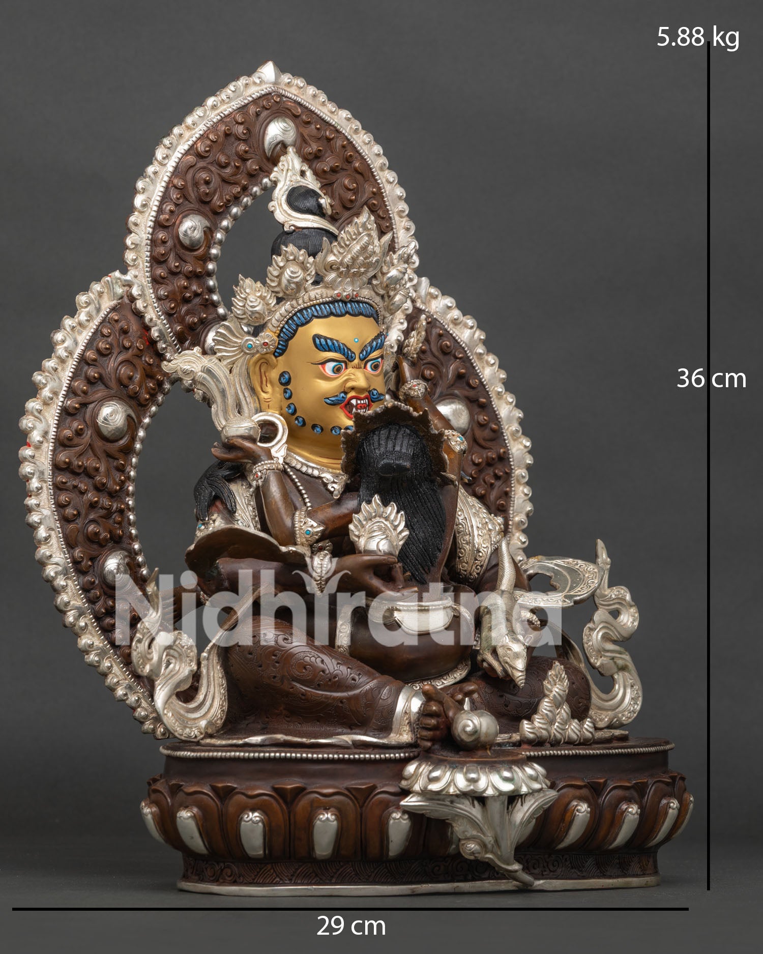 Side view of Dzambhala with consort handcrafted by Newari artisans in Nepal